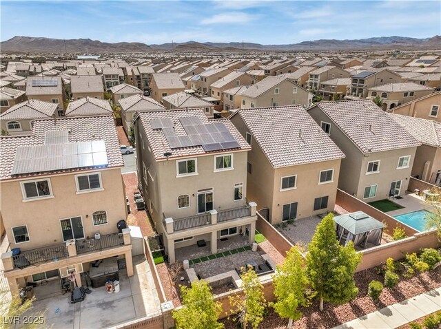 birds eye view of property featuring a mountain view and a residential view