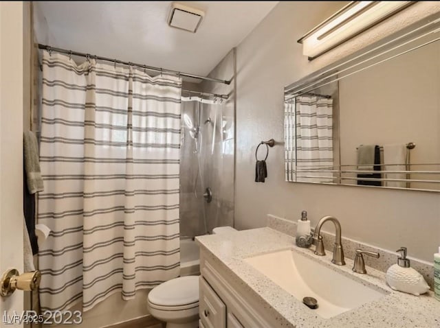 bathroom featuring shower / bath combination with curtain, toilet, and vanity