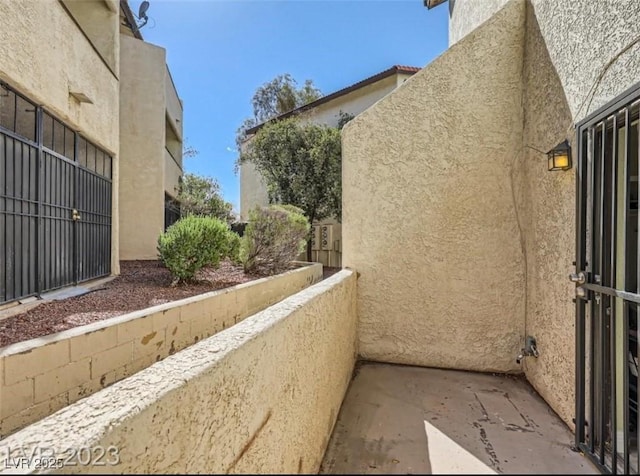 view of side of property featuring stucco siding