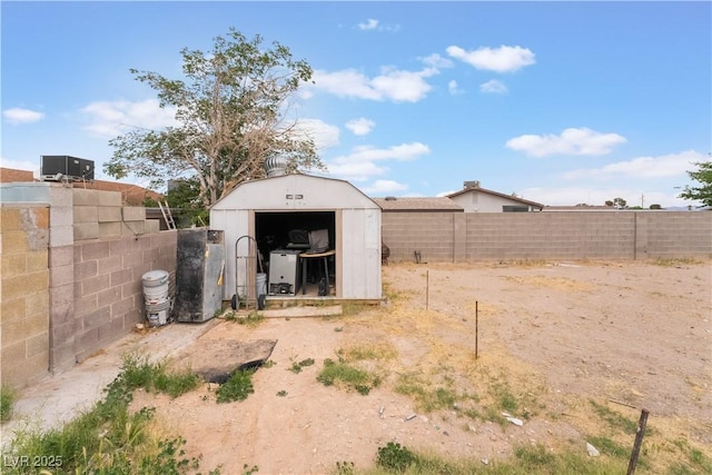view of shed featuring a fenced backyard
