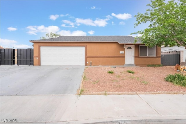 ranch-style home with concrete driveway, stucco siding, a gate, an attached garage, and fence