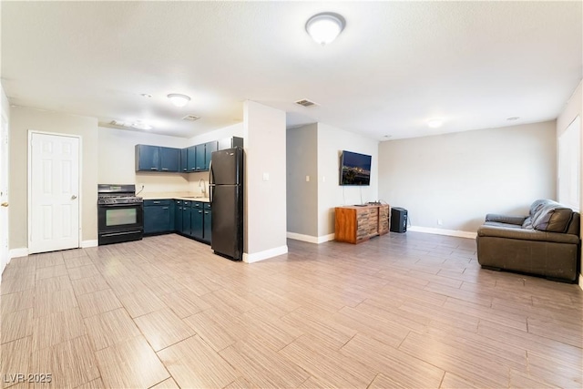 living area with baseboards and visible vents