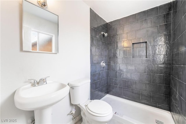 full bath with toilet, a sink, and a shower stall