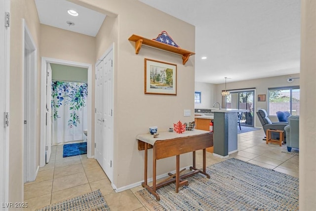 6072 Canter Glen Ave, Las Vegas, NV 89122 - corridor with recessed lighting, baseboards, a notable chandelier, and light tile patterned floors