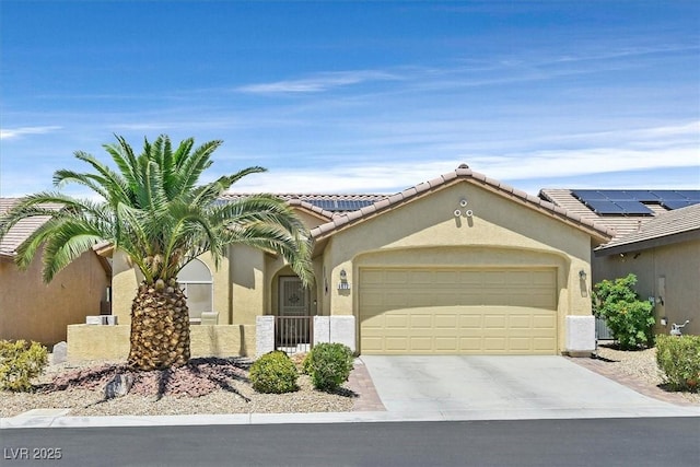 6072 Canter Glen Ave, Las Vegas, NV 89122 - mediterranean / spanish home with an attached garage, driveway, and stucco siding