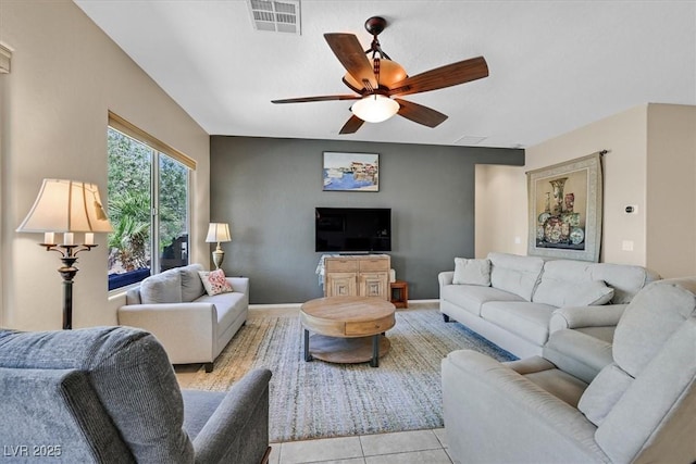 6072 Canter Glen Ave, Las Vegas, NV 89122 - living area featuring a ceiling fan, visible vents, and light tile patterned floors