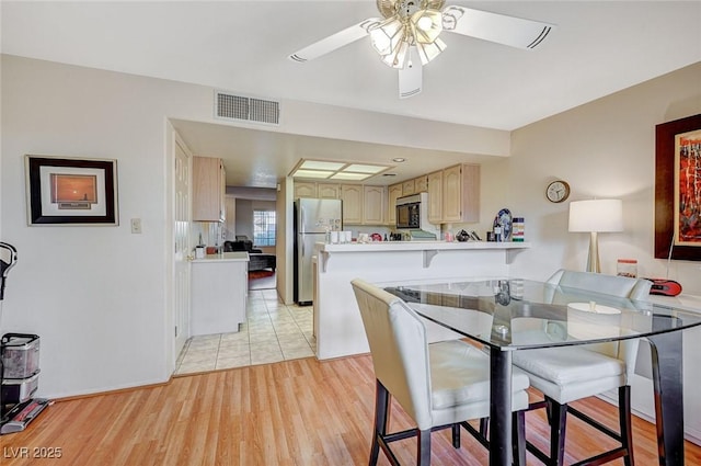 2851 S Valley View Blvd Unit 1139B, Las Vegas, NV 89102 - dining space featuring light wood-style floors, a ceiling fan, and visible vents