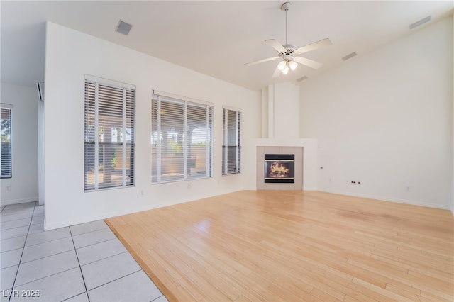 4176 Skywalker Ave, Las Vegas, NV 89120 - unfurnished living room featuring ceiling fan, light wood-style floors, a fireplace, and baseboards