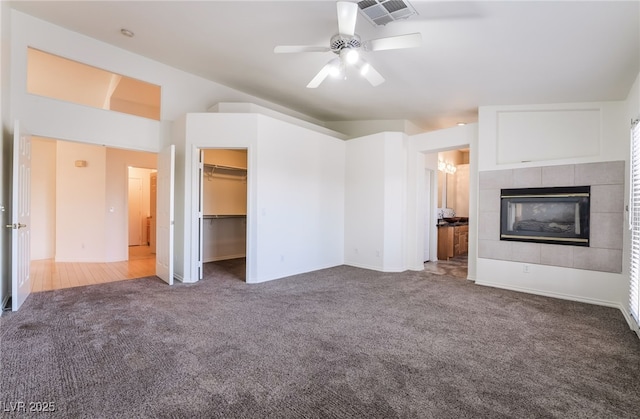 4176 Skywalker Ave, Las Vegas, NV 89120 - unfurnished living room with carpet, ceiling fan, a tiled fireplace, and baseboards