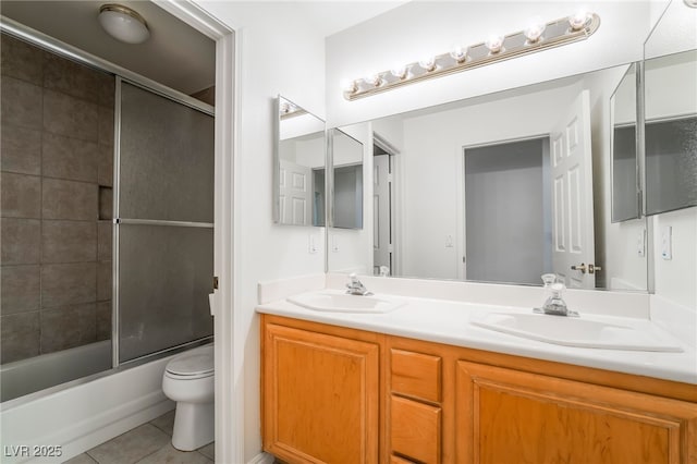 4176 Skywalker Ave, Las Vegas, NV 89120 - full bathroom with double vanity, toilet, tile patterned flooring, and shower / bath combination with glass door