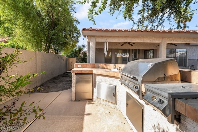 4176 Skywalker Ave, Las Vegas, NV 89120 - fenced backyard featuring ceiling fan, a sink, and a patio area