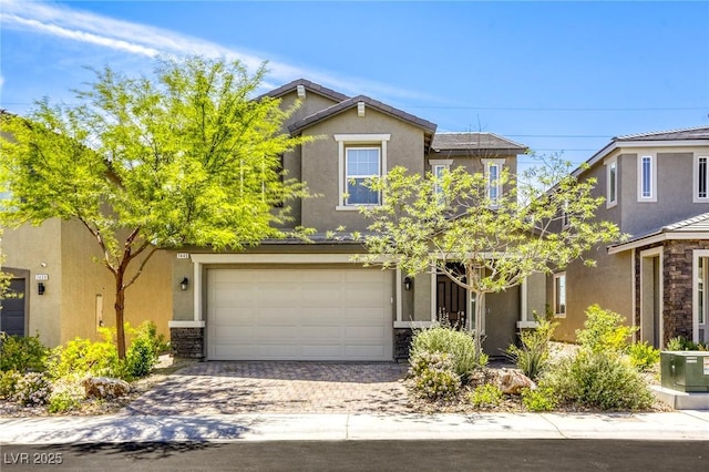 7445 Tinley Creek Ave, Las Vegas, NV 89113 - view of front of property featuring driveway, stone siding, a garage, and stucco siding