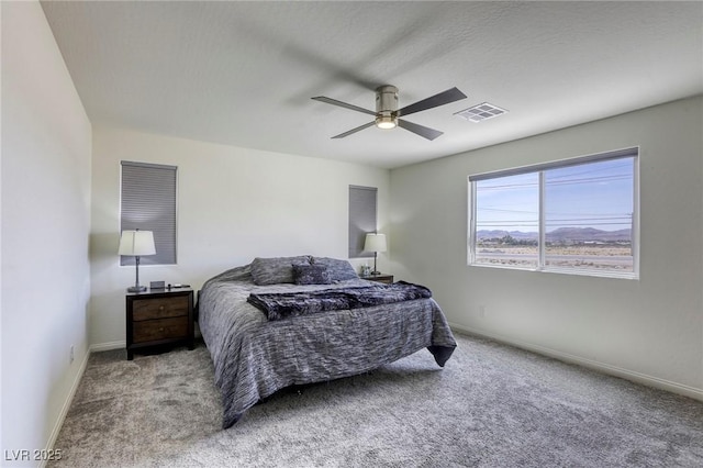 7445 Tinley Creek Ave, Las Vegas, NV 89113 - bedroom featuring visible vents, baseboards, a ceiling fan, and carpet flooring