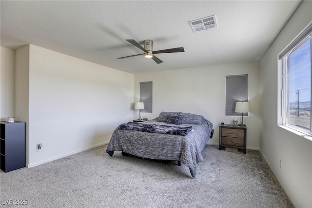 7445 Tinley Creek Ave, Las Vegas, NV 89113 - carpeted bedroom with visible vents, baseboards, and a ceiling fan