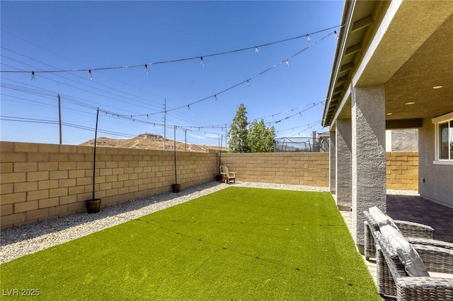 7445 Tinley Creek Ave, Las Vegas, NV 89113 - view of yard featuring a fenced backyard