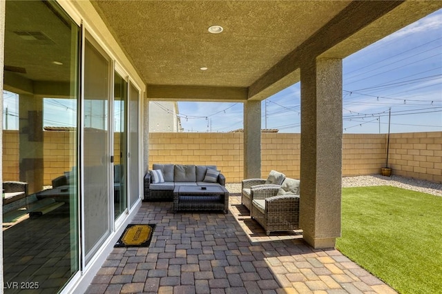 7445 Tinley Creek Ave, Las Vegas, NV 89113 - view of patio / terrace with visible vents, a fenced backyard, and an outdoor hangout area