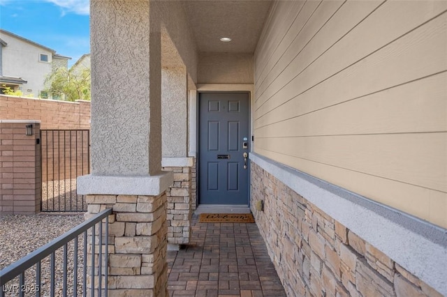 301 Resolute Ave, Henderson, NV 89011 - doorway to property with stucco siding and fence