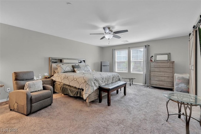 301 Resolute Ave, Henderson, NV 89011 - bedroom with a barn door, carpet floors, baseboards, and ceiling fan