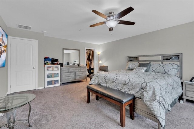 301 Resolute Ave, Henderson, NV 89011 - bedroom with carpet floors, ceiling fan, a spacious closet, a closet, and baseboards
