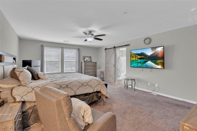 301 Resolute Ave, Henderson, NV 89011 - carpeted bedroom with a barn door, ceiling fan, and baseboards