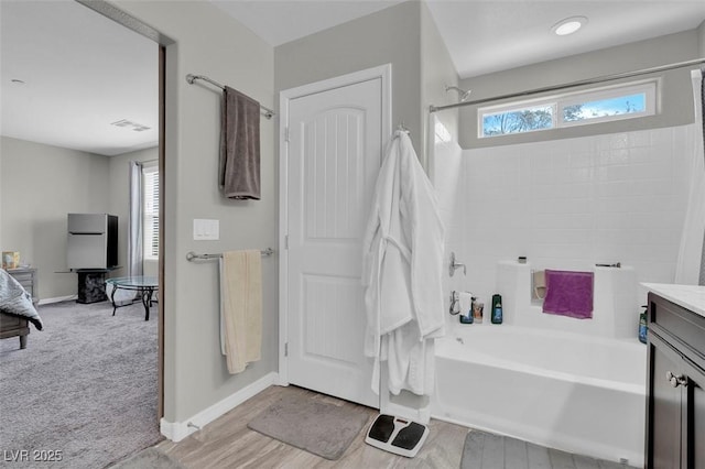 301 Resolute Ave, Henderson, NV 89011 - bathroom featuring baseboards, vanity, and shower / bathtub combination
