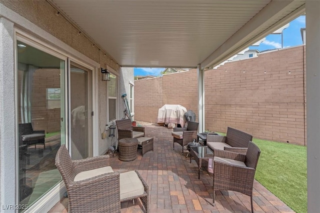301 Resolute Ave, Henderson, NV 89011 - view of patio featuring an outdoor hangout area and a fenced backyard