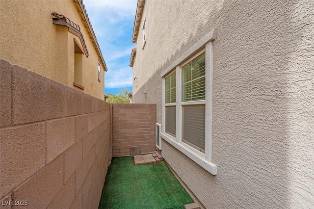 301 Resolute Ave, Henderson, NV 89011 - view of side of property featuring stucco siding and fence