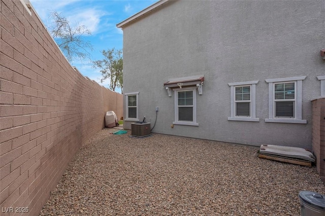 301 Resolute Ave, Henderson, NV 89011 - view of home's exterior with a fenced backyard, stucco siding, and central air condition unit