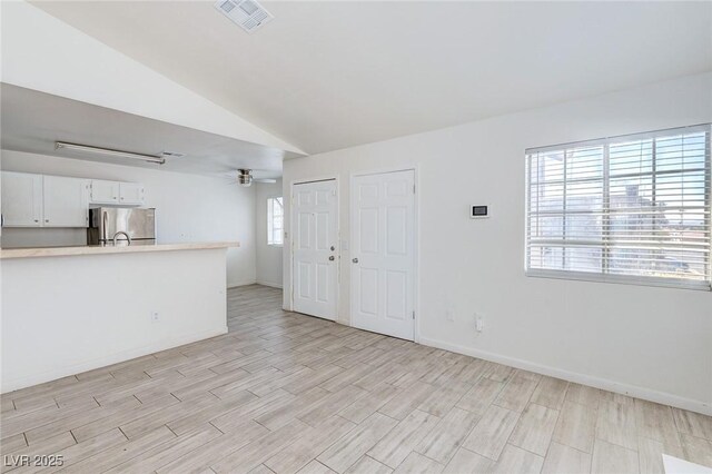 4732 Krissylouise Way, Las Vegas, NV 89121 - unfurnished living room with light wood-style flooring, visible vents, ceiling fan, and baseboards
