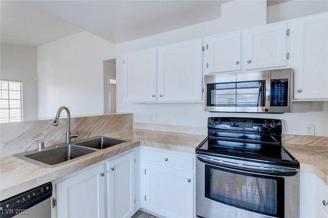 4732 Krissylouise Way, Las Vegas, NV 89121 - kitchen featuring light countertops, a sink, white cabinets, and stainless steel appliances