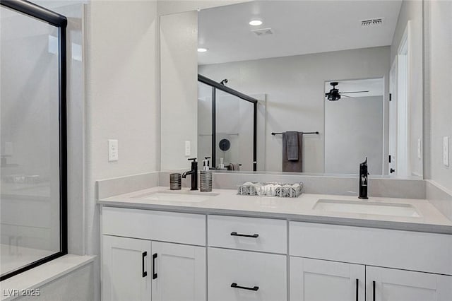 8349 Pollenzo Ave, Las Vegas, NV 89178 - full bath featuring a shower stall, ceiling fan, double vanity, and recessed lighting