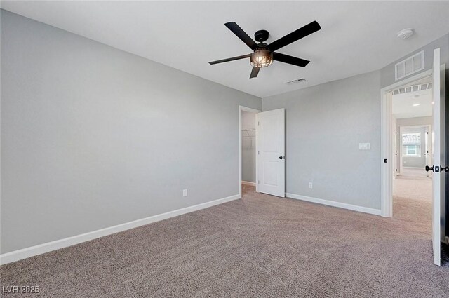8349 Pollenzo Ave, Las Vegas, NV 89178 - unfurnished bedroom featuring carpet, baseboards, a ceiling fan, and a spacious closet