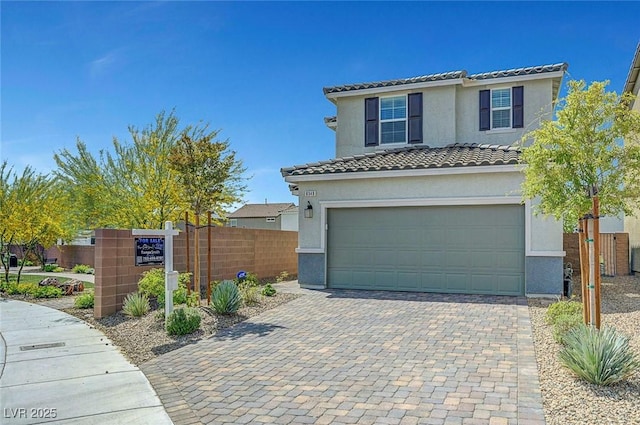 8349 Pollenzo Ave, Las Vegas, NV 89178 - traditional-style house with stucco siding, an attached garage, a tile roof, fence, and decorative driveway