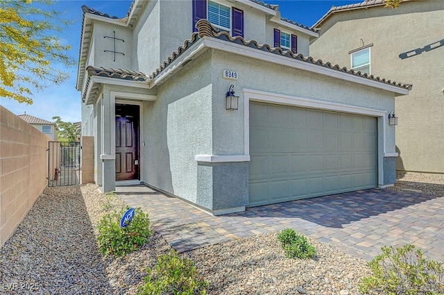 8349 Pollenzo Ave, Las Vegas, NV 89178 - mediterranean / spanish-style house with a tiled roof, stucco siding, a gate, and fence
