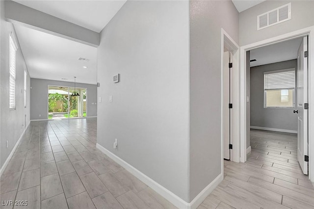 8349 Pollenzo Ave, Las Vegas, NV 89178 - corridor featuring baseboards and wood tiled floors