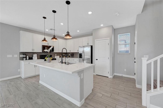 8349 Pollenzo Ave, Las Vegas, NV 89178 - kitchen featuring stainless steel fridge with ice dispenser, decorative backsplash, a sink, white cabinets, and recessed lighting