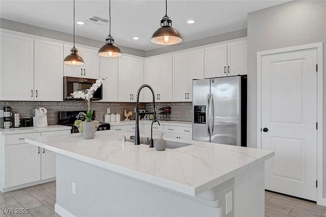 8349 Pollenzo Ave, Las Vegas, NV 89178 - kitchen featuring black appliances, tasteful backsplash, white cabinets, and recessed lighting