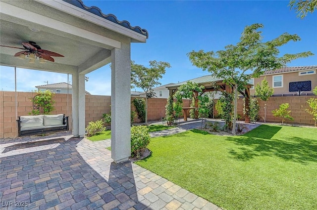 8349 Pollenzo Ave, Las Vegas, NV 89178 - view of yard featuring a gazebo, a ceiling fan, and a patio area