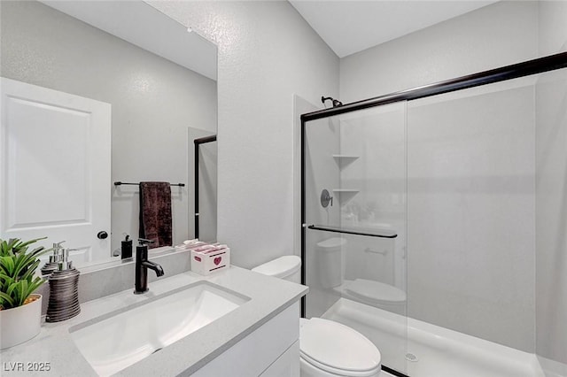 8349 Pollenzo Ave, Las Vegas, NV 89178 - bathroom featuring toilet, a shower stall, and vanity