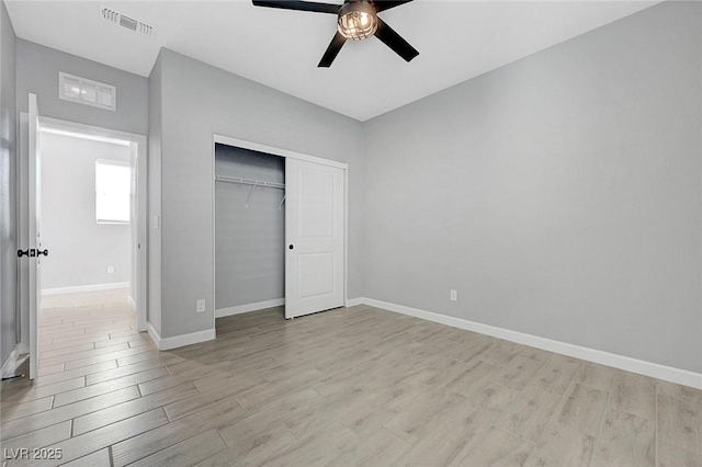 8349 Pollenzo Ave, Las Vegas, NV 89178 - unfurnished bedroom with light wood-style flooring, baseboards, a closet, and ceiling fan