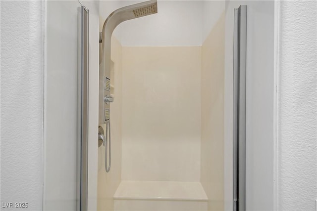 437 Via Stretto Ave, Henderson, NV 89011 - bathroom with a textured wall and walk in shower