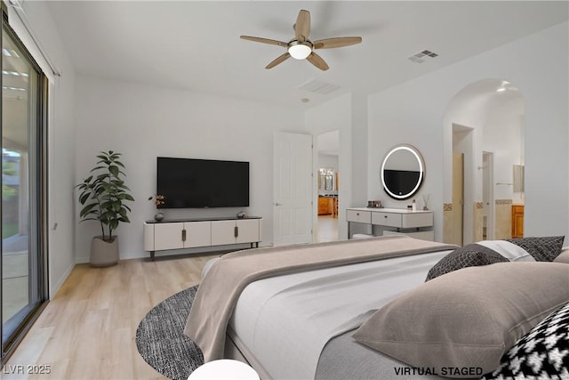 437 Via Stretto Ave, Henderson, NV 89011 - bedroom featuring visible vents, access to exterior, arched walkways, light wood-style flooring, and ceiling fan