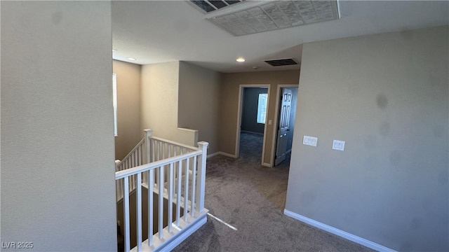 corridor with an upstairs landing, carpet, baseboards, and recessed lighting