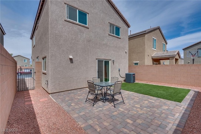 5256 Sherwood Forest Ln, Las Vegas, NV 89122 - rear view of house featuring a patio area, stucco siding, fence, and central AC