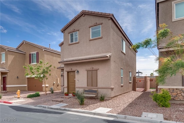 5256 Sherwood Forest Ln, Las Vegas, NV 89122 - traditional-style home featuring a gate and stucco siding