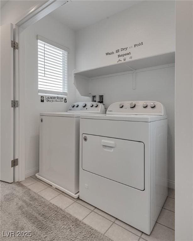 5256 Sherwood Forest Ln, Las Vegas, NV 89122 - laundry room with laundry area, light tile patterned floors, and washing machine and dryer