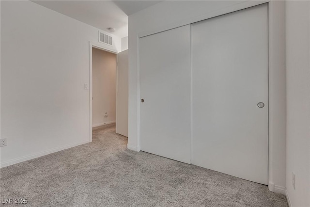 5256 Sherwood Forest Ln, Las Vegas, NV 89122 - unfurnished bedroom with a closet, visible vents, and carpet floors