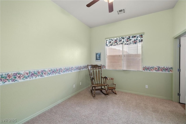 sitting room featuring visible vents, baseboards, a ceiling fan, and carpet floors