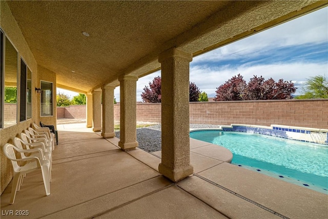 view of pool with a fenced in pool, a patio, and a fenced backyard