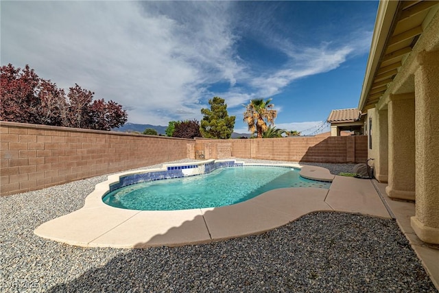 view of swimming pool with a fenced backyard, a fenced in pool, and a patio area